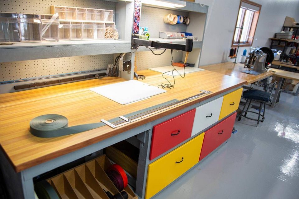 Rigger repair table with colorful drawers at the US Academy of Parachute Rigging in Eloy, AZ