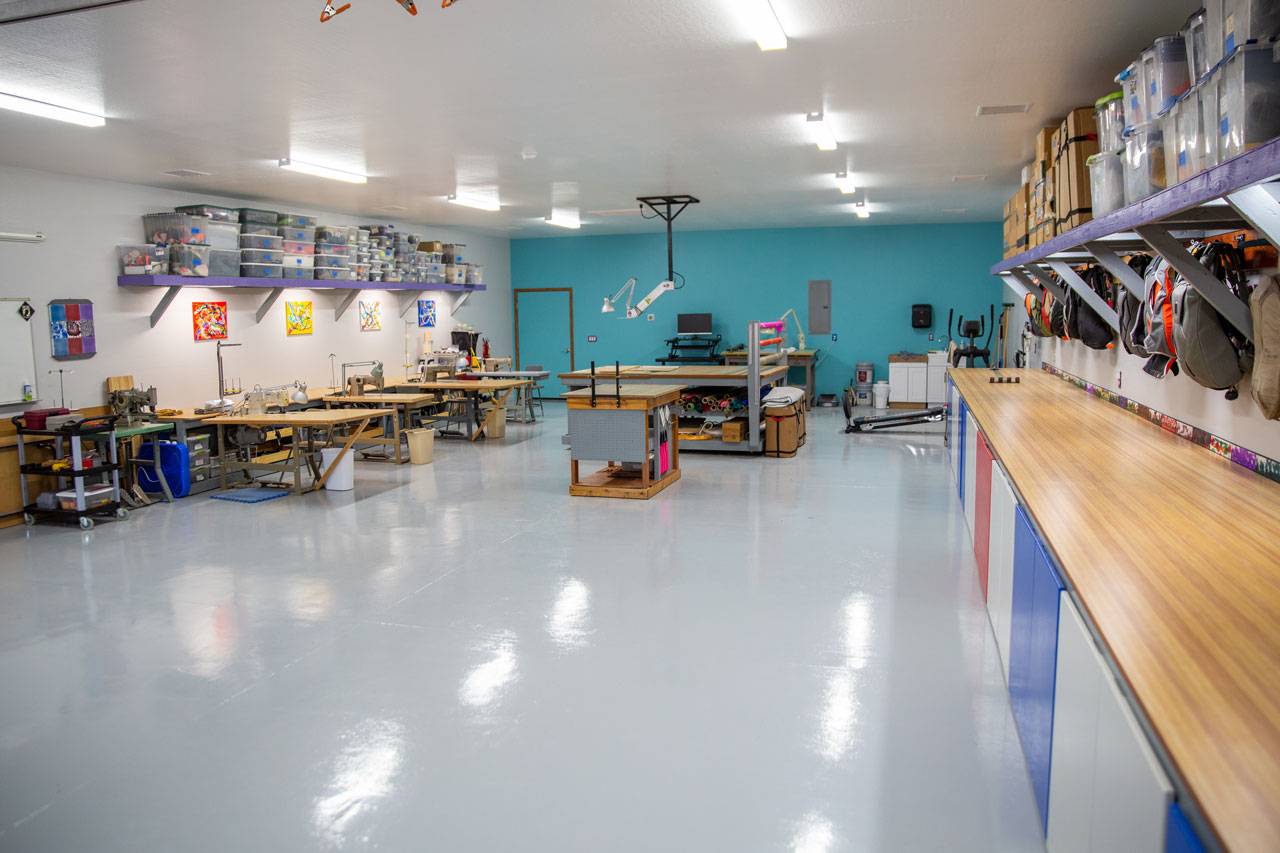 USAPR parachute training school custom-built rigging loft with sewing stations and packing table